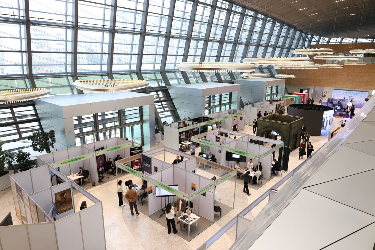 Buyers walking the aisles of a trade fair hall — the Canton Fair helps buyers identify potential suppliers; verifying capabilities is the next step